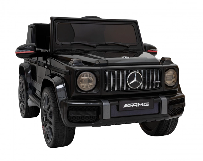 Mercedes AMG G63 per bambini nero + telecomando + MP3 LED + partenza lenta + EVA + cinture di sicurezza