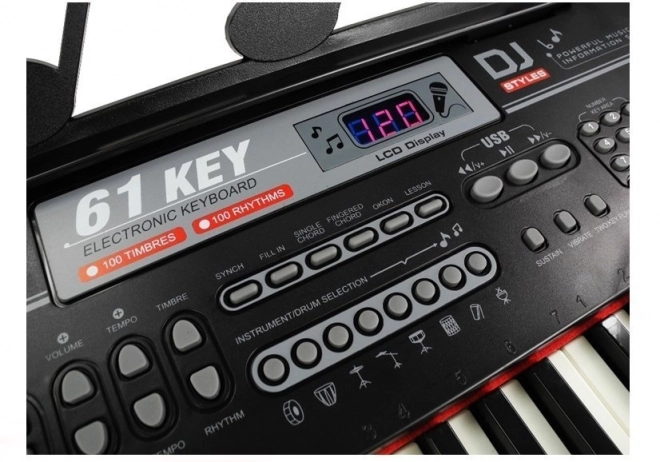 Keyboard musicale nero con microfono e alimentatore