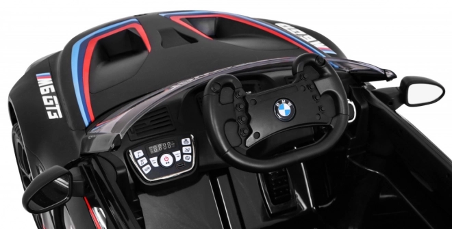BMW M6 GT3 Auto a batteria per bambini nero + ventilazione + suoni MP3 Luci + telecomando