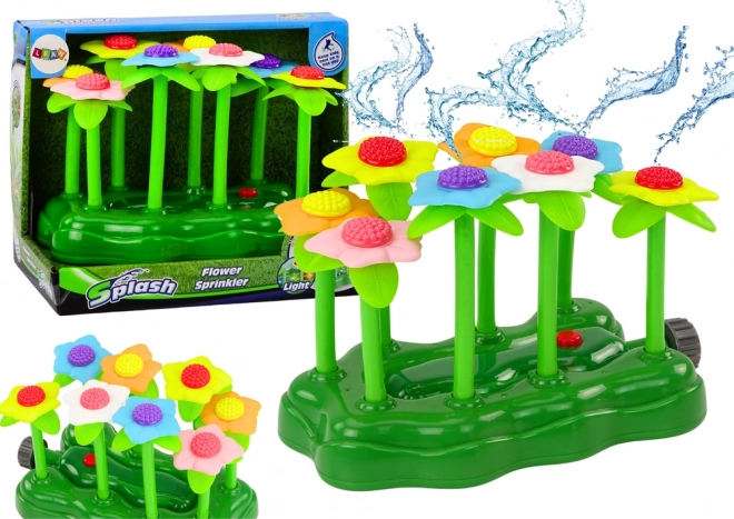 Gioco d'acqua da giardino con fiori e fontana luminosa per bambini