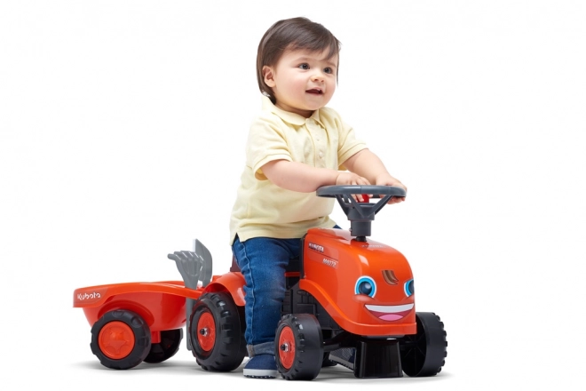 Trattore a pedali per bambini Kubota con rimorchio e accessori