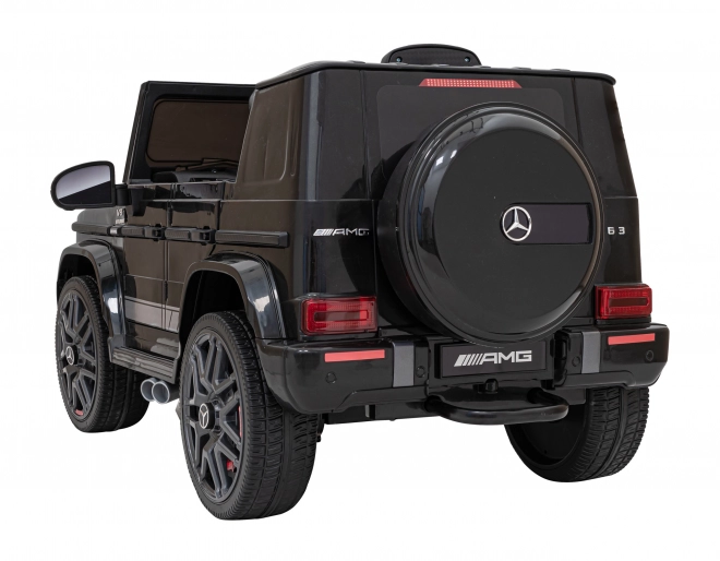 Mercedes AMG G63 per bambini nero + telecomando + MP3 LED + partenza lenta + EVA + cinture di sicurezza