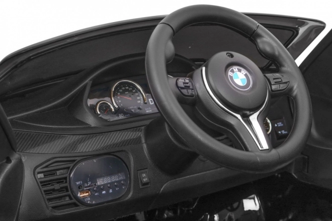 Auto elettrico per bambini BMW X6M nero + telecomando + EVA + avvio lento + pannello audio + LED