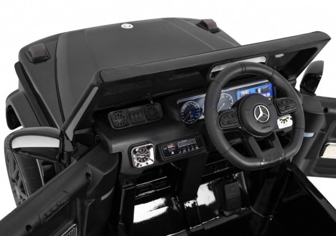 Mercedes AMG G63 per bambini Laccato nero + telecomando + MP3 LED + partenza lenta + EVA + cinture