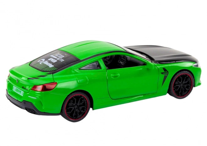 Auto sportiva verde in metallo con elementi apribili 1:24