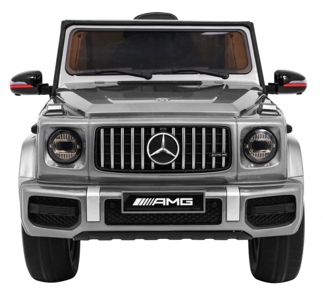 Mercedes AMG G63 per bambini Vernice argento + telecomando + MP3 LED + avvio lento + EVA + cinture