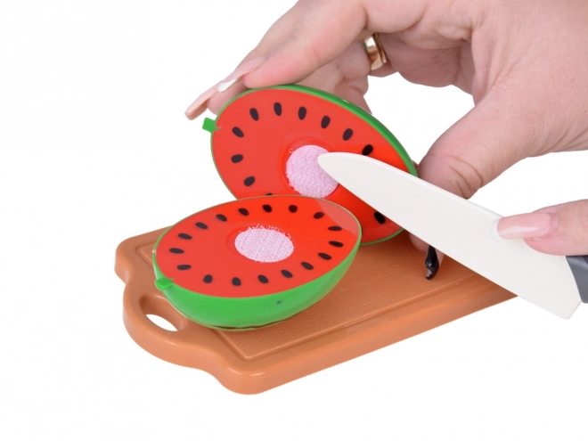 Set di frutta in plastica da tagliare con tagliere e coltello