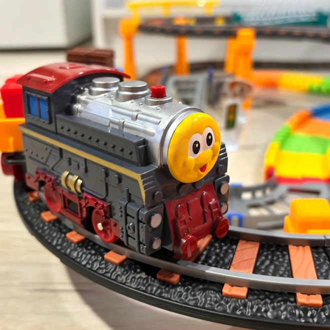 Set pista da corsa e trenino elettrico 2 in 1