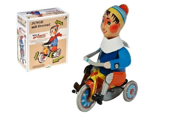 Ragazzo su triciclo a molla in metallo 15cm in scatola Kovap