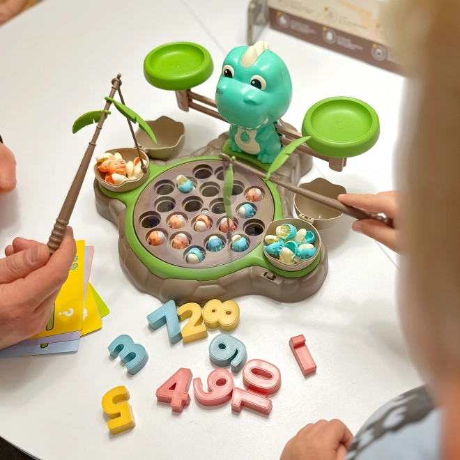 Gioco educativo Dinozaur con bilancia e cattura di WOOPIE