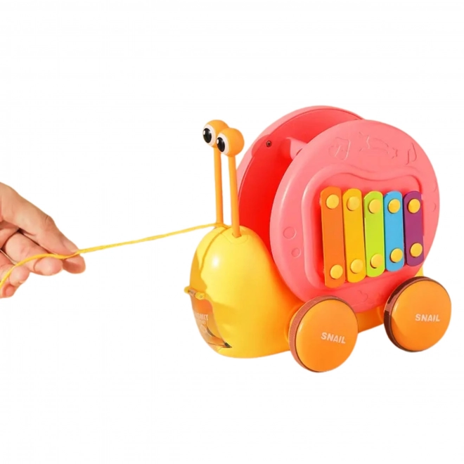 Giocattolo Multifunzione Lumaca da Tiro 4 in 1 con Xilofono e Lanciatore