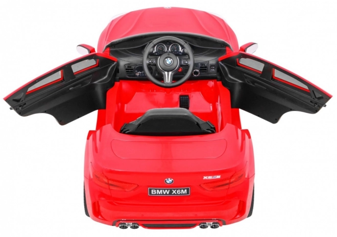 BMW X6M Auto elettrico per bambini rosso + telecomando + EVA + avvio lento + pannello audio + LED