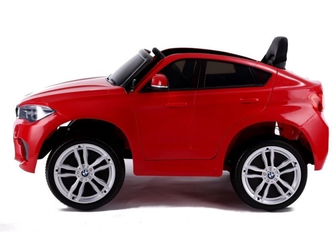 Macchina a Batteria BMW X6 Rossa in Pelle e Ruote EVA