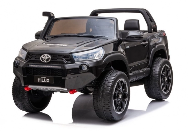 Auto elettrico per bambini Toyota Hilux bianco – Nera