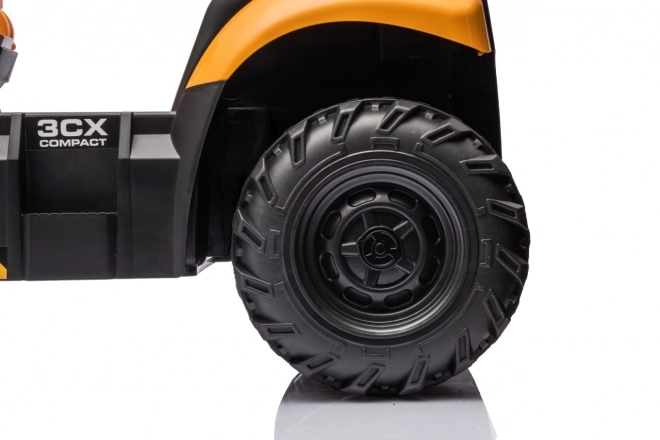 Veicolo JCB con escavatore giallo