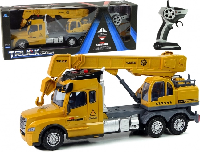 Camion giallo telecomandato con gru e suoni