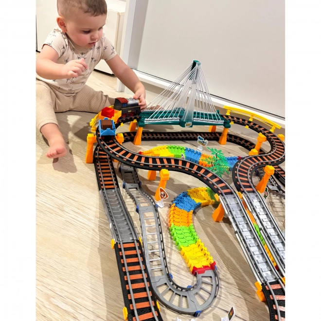 Set pista da corsa e trenino elettrico 2 in 1