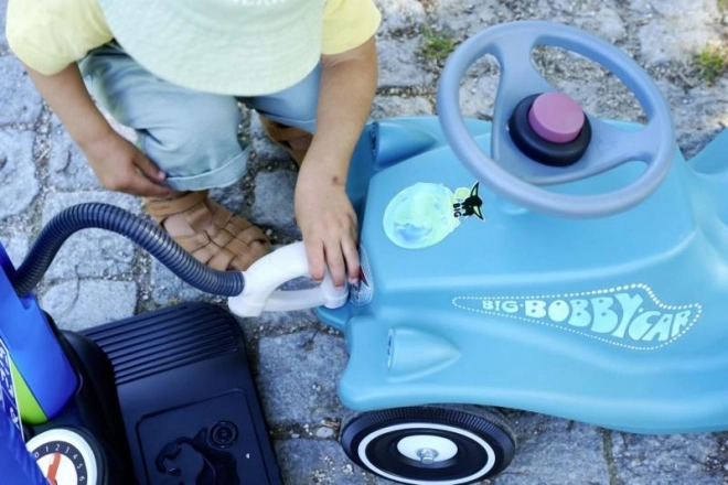 Auto a spinta con rimorchio in colore turchese