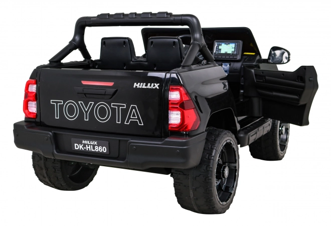 Toyota Hilux batteria per bambini nera + trazione 4x4 + telecomando + 2 portapacchi + radio MP3 + LED