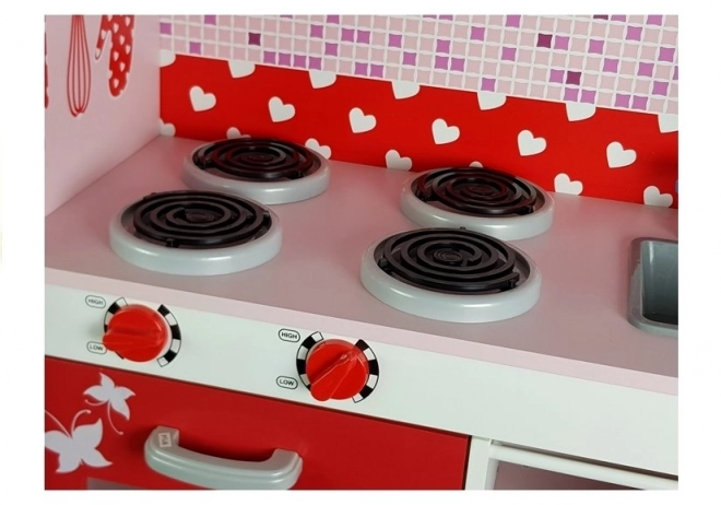 Cucina in legno per bambini con frigorifero e microonde