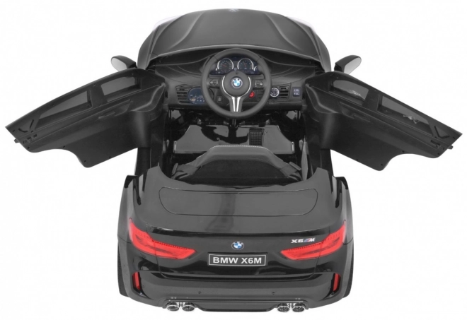 Auto elettrico per bambini BMW X6M nero + telecomando + EVA + avvio lento + pannello audio + LED