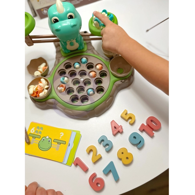 Gioco educativo Dinozaur con bilancia e cattura di WOOPIE