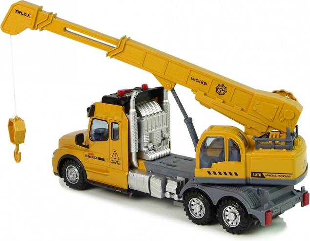 Camion giallo telecomandato con gru e suoni