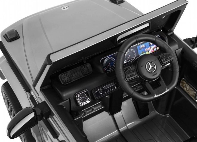 Mercedes AMG G63 per bambini Vernice argento + telecomando + MP3 LED + avvio lento + EVA + cinture
