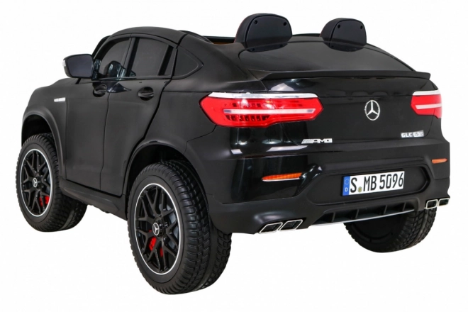 Mercedes GLC 63S auto per bambini nero + 4x4 + MP4 + LED + Eco pelle + Partenza lenta + EVA