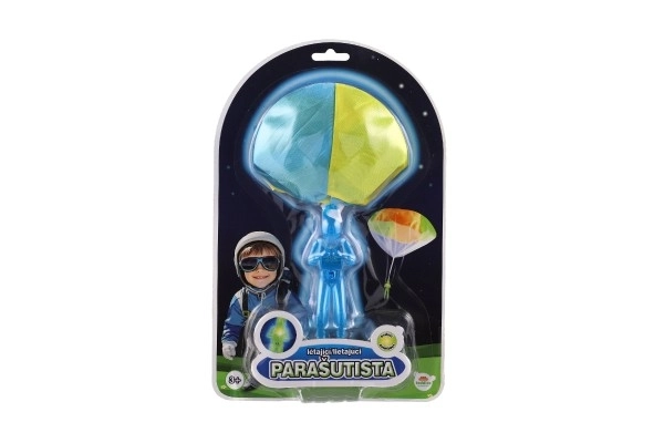 Paracadutista giocattolo con paracadute e luce