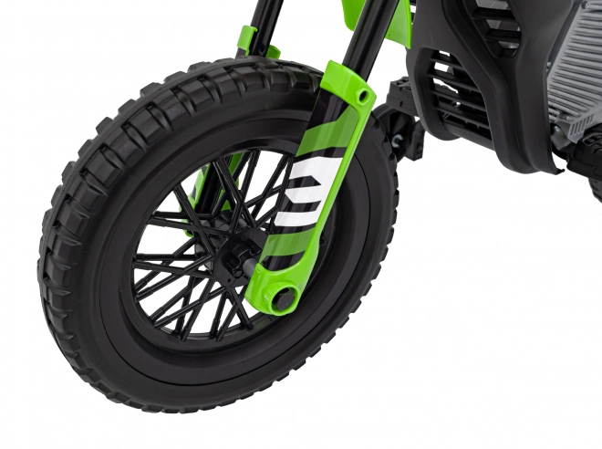 Moto verde per bambini a batteria con pannello audio e ruote in EVA