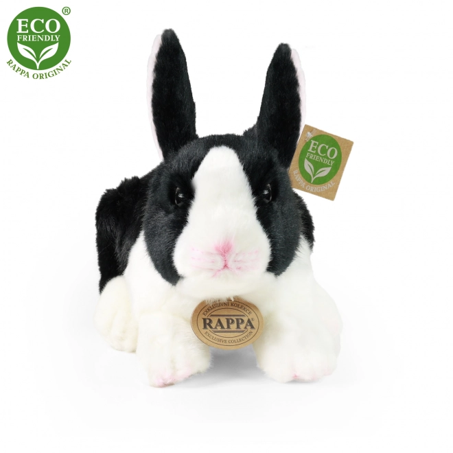 Coniglio peluche bianco e nero sdraiato eco-friendly