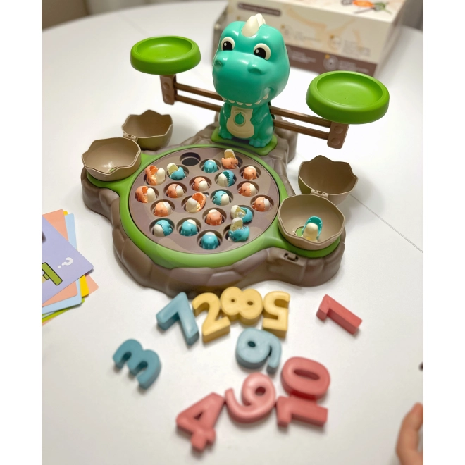Gioco educativo Dinozaur con bilancia e cattura di WOOPIE