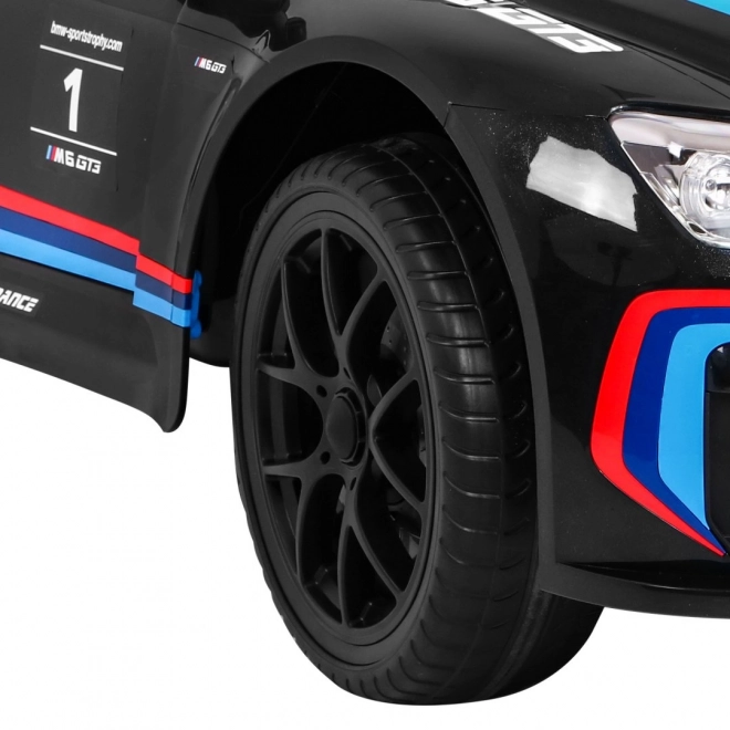 BMW M6 GT3 Auto a batteria per bambini nero + ventilazione + suoni MP3 Luci + telecomando