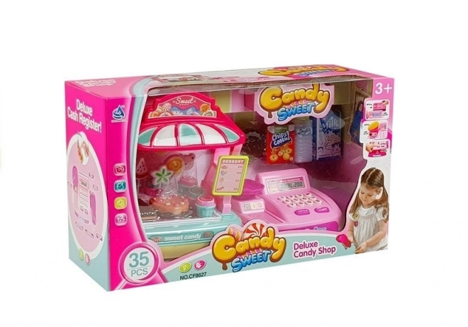Cassa del registratore di cassa per bambini con stand di dolciumi