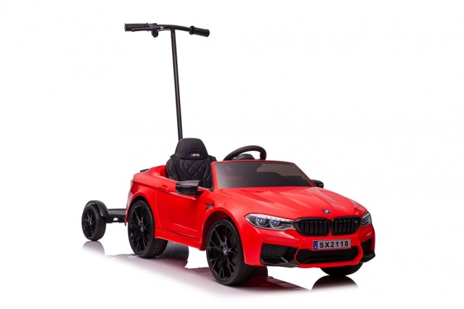 Auto a batteria BMW M5 con piattaforma per genitore rosso laccato