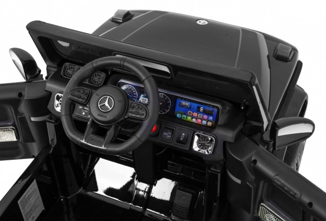 Mercedes AMG G63 per bambini Laccato nero + telecomando + MP3 LED + partenza lenta + EVA + cinture