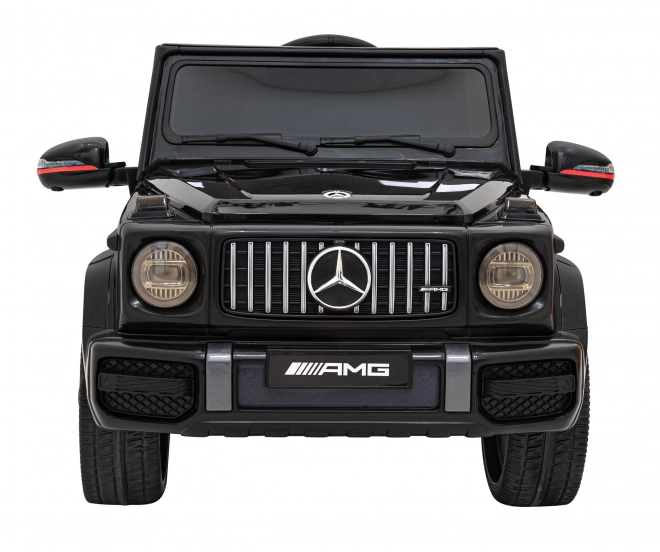 Mercedes AMG G63 per bambini nero + telecomando + MP3 LED + partenza lenta + EVA + cinture di sicurezza