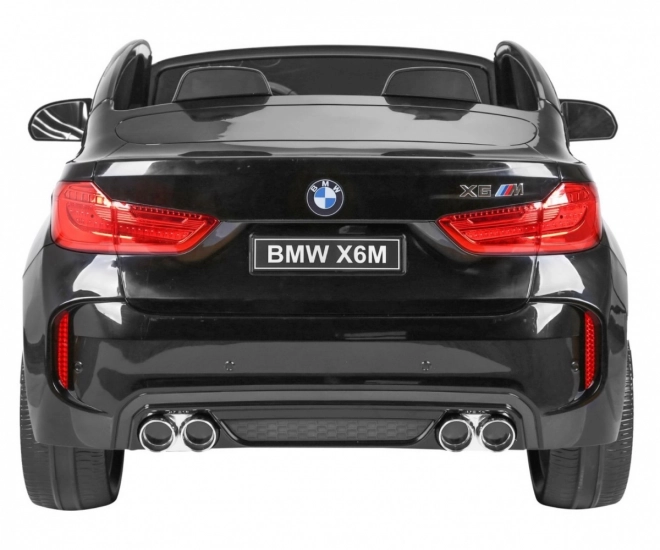BMW X6M XXL pro 2 bambini Vernice nera + Telecomando + Pelle Eko + Cinture di sicurezza + Partenza lenta + MP3 + LED