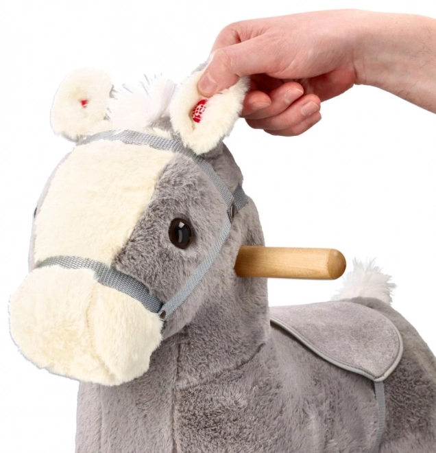 Cavallo a dondolo di peluche
