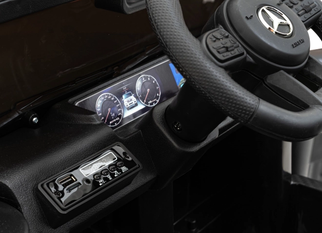Mercedes AMG G63 per bambini nero + telecomando + MP3 LED + partenza lenta + EVA + cinture di sicurezza