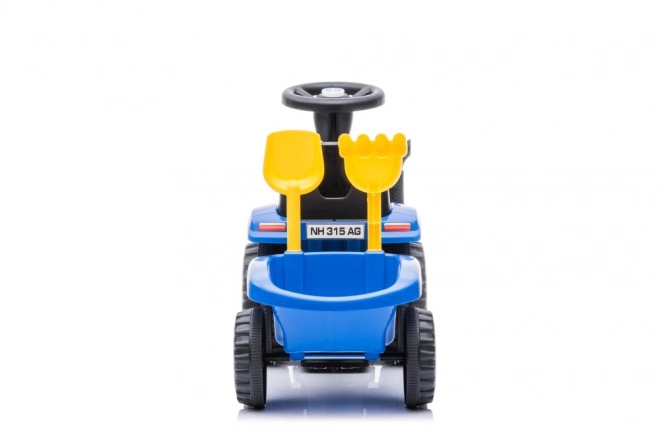 Trattore cavalcabile New Holland blu