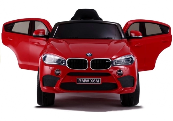 Macchina a Batteria BMW X6 Rossa in Pelle e Ruote EVA