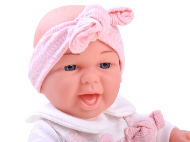 Bebè realistico con sorriso