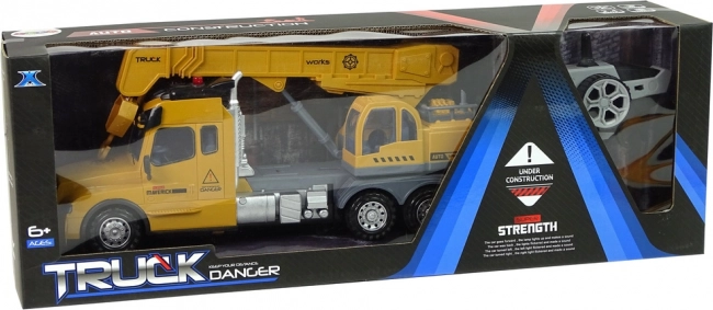 Camion giallo telecomandato con gru e suoni