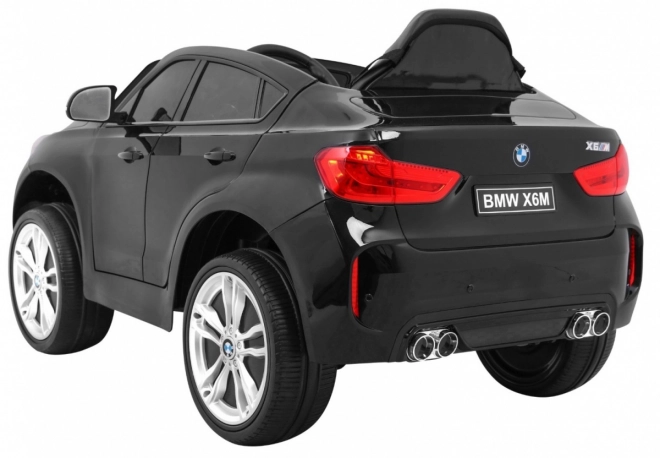 Auto elettrico per bambini BMW X6M nero + telecomando + EVA + avvio lento + pannello audio + LED