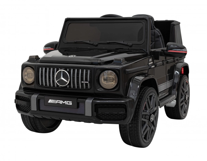 Mercedes AMG G63 per bambini nero + telecomando + MP3 LED + partenza lenta + EVA + cinture di sicurezza