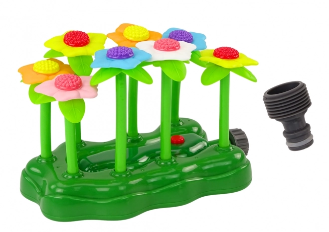 Gioco d'acqua da giardino con fiori e fontana luminosa per bambini