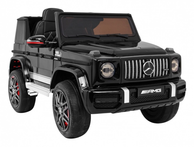 Mercedes AMG G63 per bambini Laccato nero + telecomando + MP3 LED + partenza lenta + EVA + cinture