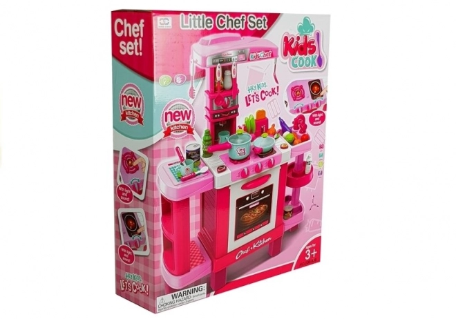 Grande cucina rosa per bambini con tostapane e macchina da caffè